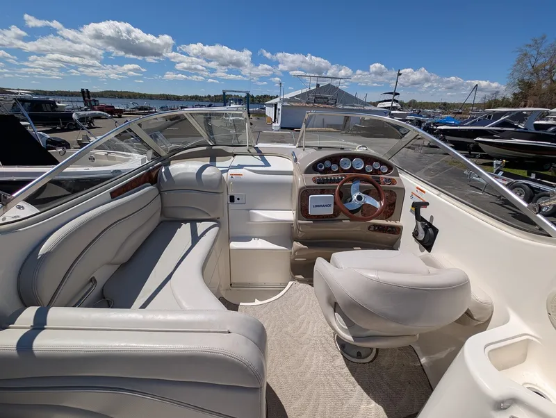 Slide: The Image of Interior of a 2007 Larson Cabrio 240 yacht with helm console. - 12