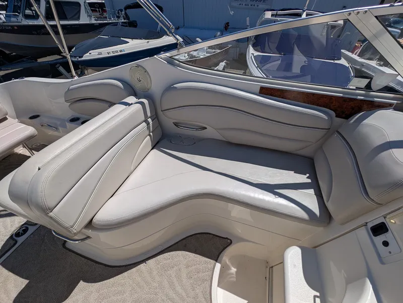 Slide: The Image of Interior of a 2007 Larson Cabrio 240 boat with white seating. - 15