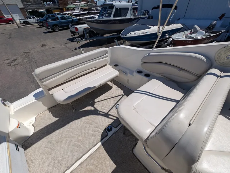 Slide: The Image of Interior of a 2007 Larson Cabrio 240 boat with seating area. - 18