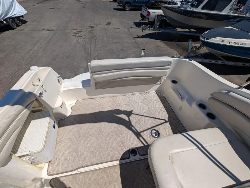 Slide: The Image of Interior of a 2007 Larson Cabrio 240 boat with beige carpet. - 19