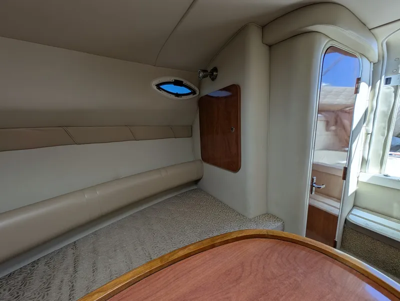 Slide: The Image of Interior of a 2007 Larson Cabrio 240 yacht with elegant upholstery. - 22