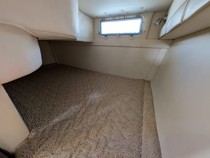Slide: The Image of Interior of 2007 Larson Cabrio 240 yacht with window. - 27