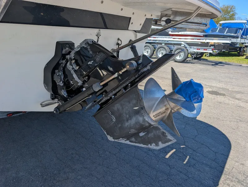 Slide: The Image of Larson Cabrio 240 2007 boat drive with propeller on parking lot. - 7