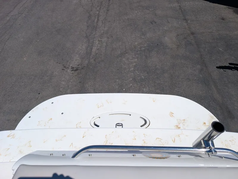 Slide: The Image of Larson Cabrio 240 boat hull, 2007 model, parked on asphalt. - 8