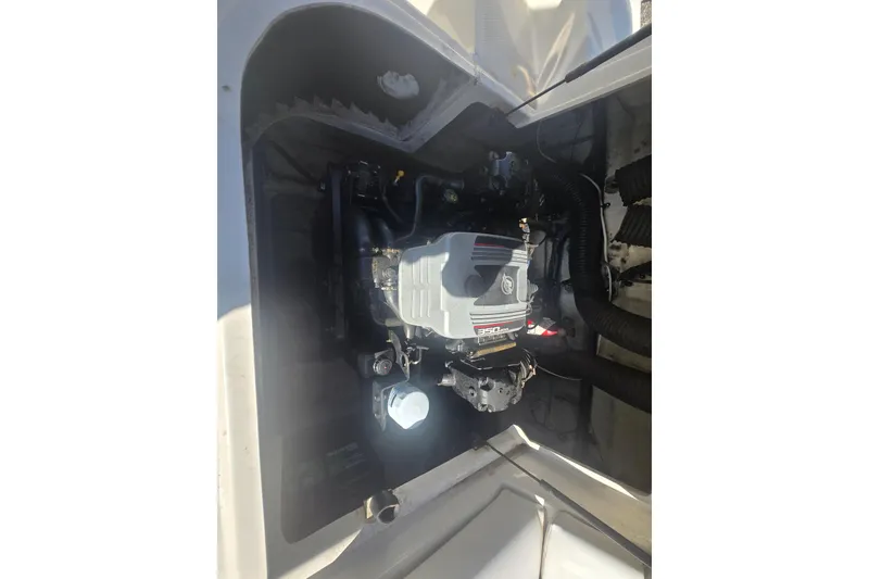 Slide: The Image of Engine compartment of a 2009 Sea Ray 240 Sundeck boat. - 16