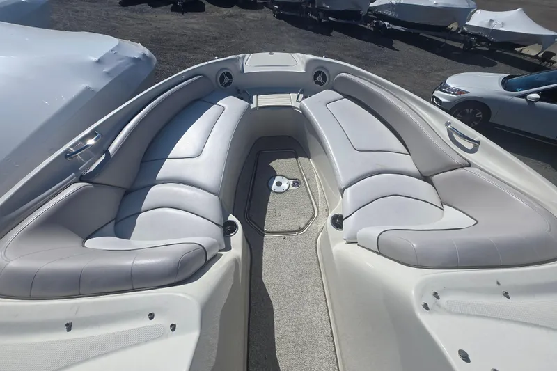 Slide: The Image of 2009 Sea Ray 240 Sundeck boat interior with spacious seating and sleek design. - 2