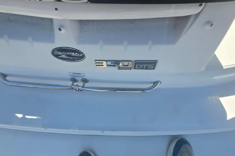 Slide: The Image of 2009 Sea Ray 240 Sundeck boat with MarineMax and 350 DTS badges. - 20
