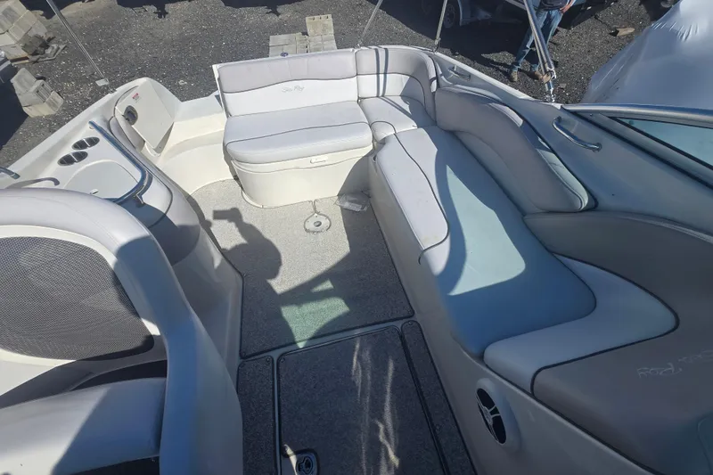 Slide: The Image of 2009 Sea Ray 240 Sundeck interior with spacious seating and modern design. - 7
