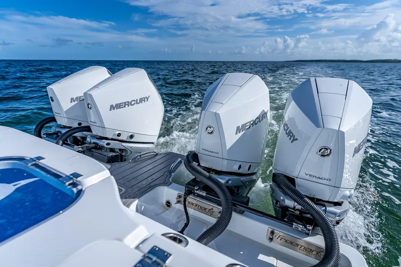 Slide: The Image of Freeman 35 boat with four Mercury Verado engines on the sea, 2025 model. - 10