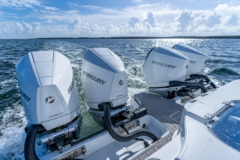 Slide: The Image of Freeman 35 boat with three Mercury outboard engines on water, 2025 model. - 11