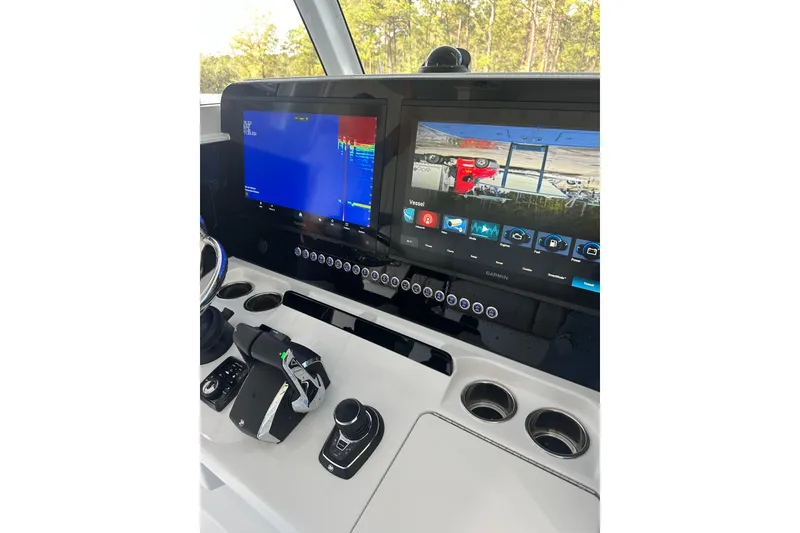 Slide: The Image of Control panel of a 2025 Freeman 35 boat with advanced navigation displays. - 4