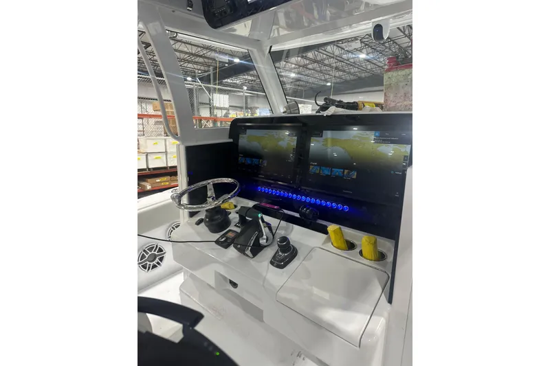 Slide: The Image of Cockpit of 2025 Freeman 35 boat with advanced navigation displays and controls. - 5