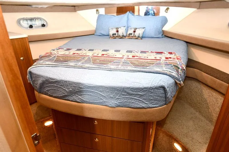 Slide: The Image of Luxurious bedroom interior of 2001 Bayliner 3788 Command Bridge Motoryacht with cozy bedding. - 12