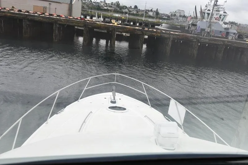Slide: The Image of Bow view of 2001 Bayliner 3788 Command Bridge Motoryacht approaching a dock. - 18