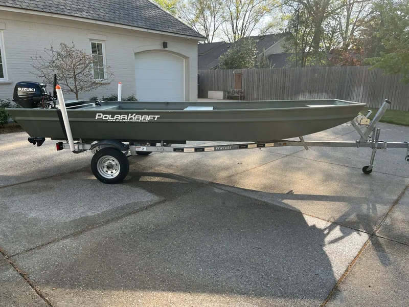 The Image of 2022 Polar Kraft DKJ1648-15 boat on trailer outdoors. - 1