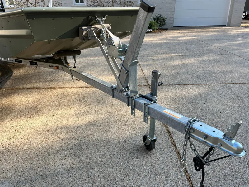 Slide: The Image of 2022 Polar Kraft DKJ1648-15 boat on trailer in driveway. - 4