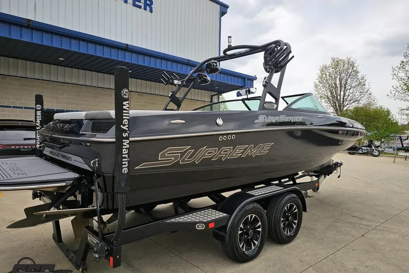 Slide: The Image of 2018 Supreme S226 boat on trailer at Willey's Marine dealership. - 12