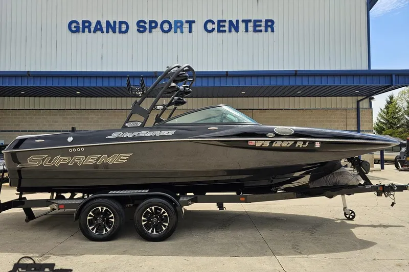 Slide: The Image of 2018 Supreme S226 boat on trailer at Grand Sport Center. - 2