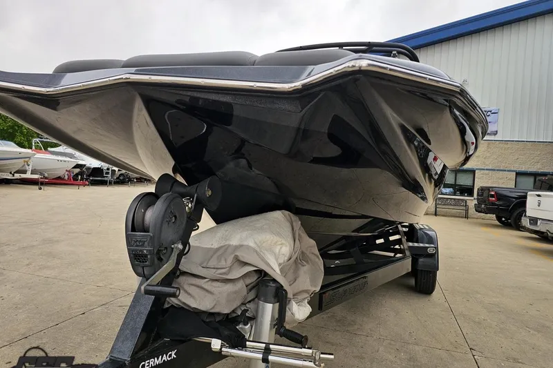 Slide: The Image of 2018 Supreme S226 boat on trailer, parked outdoors near a building. - 20