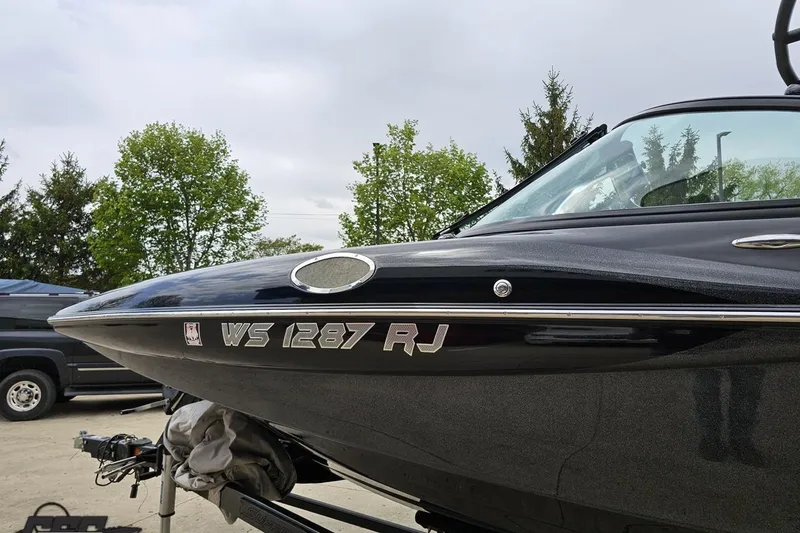 Slide: The Image of 2018 Supreme S226 boat with registration WS 1287 RJ, parked outdoors. - 26