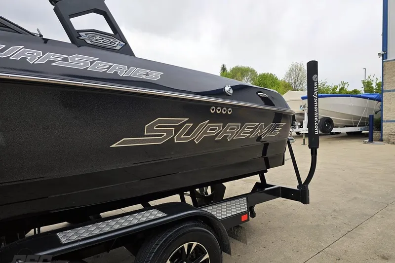 Slide: The Image of 2018 Supreme S226 boat on trailer, featuring Surf Series branding. - 29