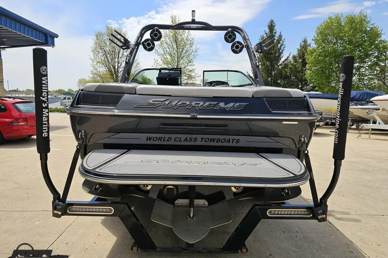 Slide: The Image of 2018 Supreme S226 towboat at Willey's Marine dealership, showcasing sleek design and branding. - 33
