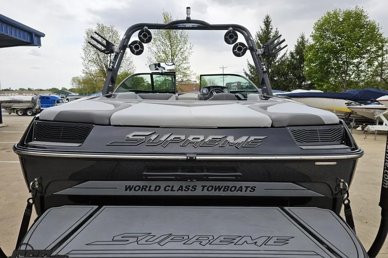 Slide: The Image of 2018 Supreme S226 boat, rear view, showcasing "World Class Towboats" branding. - 35