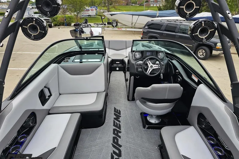 Slide: The Image of 2018 Supreme S226 boat interior with modern seating and advanced dashboard controls. - 46
