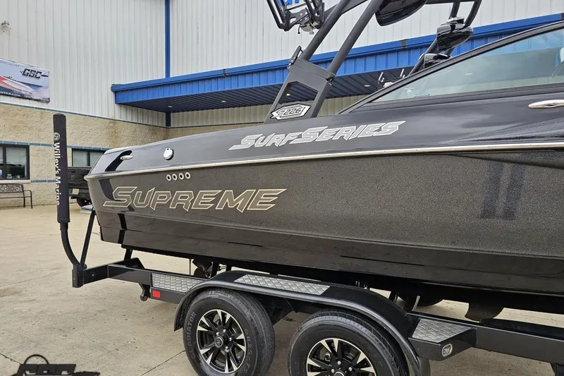 Slide: The Image of 2018 Supreme S226 boat on trailer at Willey's Marine dealership. - 5