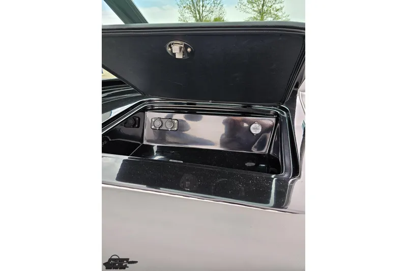 Slide: The Image of Open storage compartment in a 2018 Supreme S226 boat, showcasing interior details. - 57