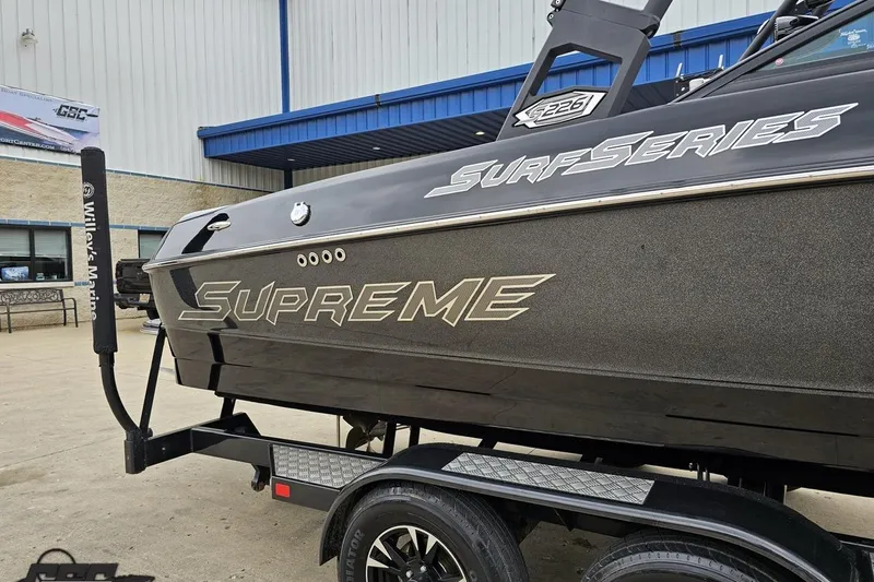 Slide: The Image of 2018 Supreme S226 Surf Series boat on trailer at Willey's Marine. - 6