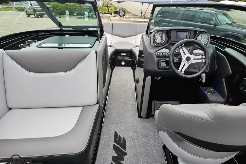 Slide: The Image of Interior of a 2018 Supreme S226 boat with modern dashboard and seating. - 60