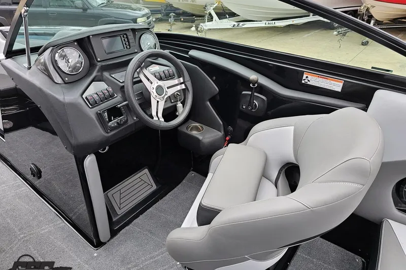 Slide: The Image of 2018 Supreme S226 boat interior with modern dashboard and comfortable seating. - 61