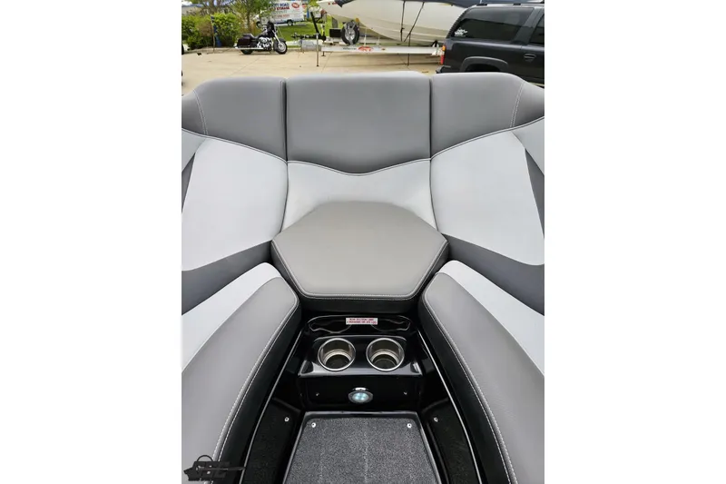 Slide: The Image of Interior of 2018 Supreme S226 boat with gray and white seating and cup holders. - 73