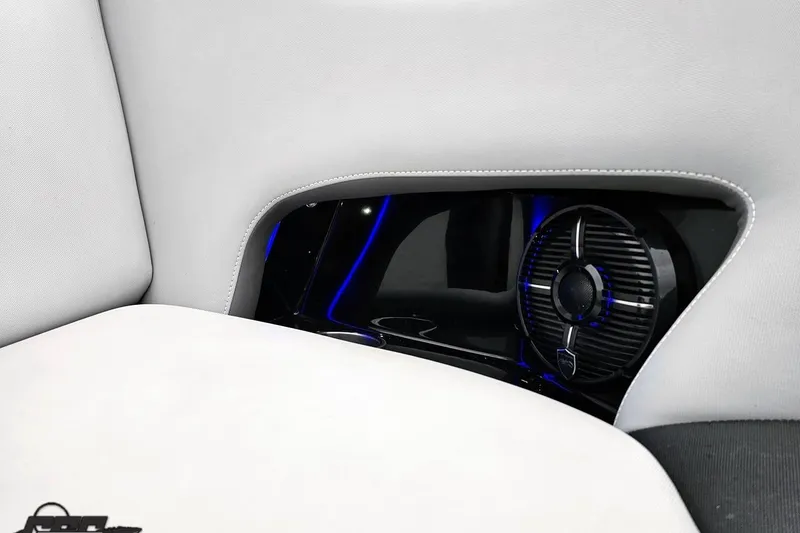 Slide: The Image of Interior of 2018 Supreme S226 boat featuring sleek speaker design and modern upholstery. - 77