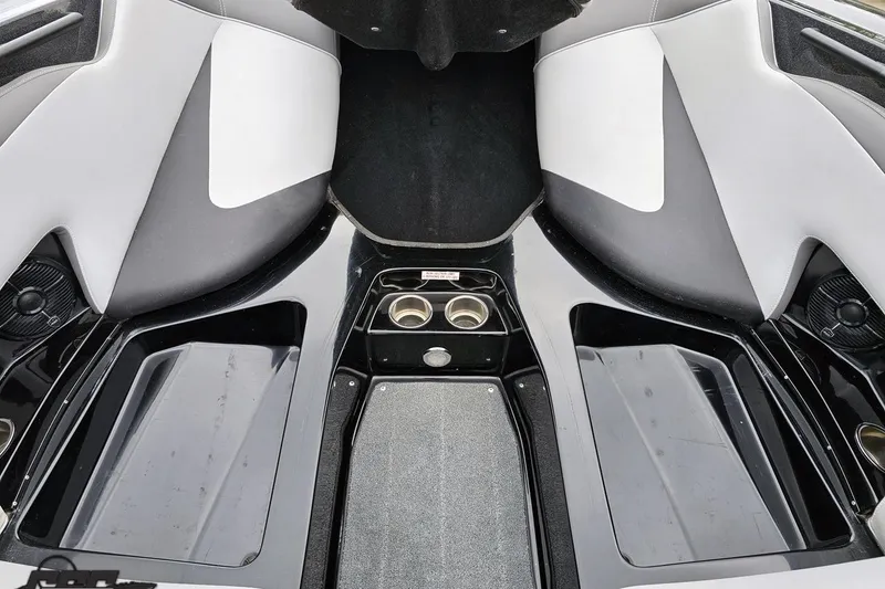 Slide: The Image of Interior of a 2018 Supreme S226 boat, featuring sleek black and white seating. - 78