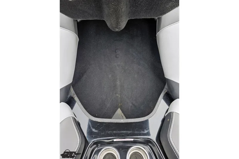 Slide: The Image of 2018 Supreme S226 boat interior with black carpet and gray seating. - 82