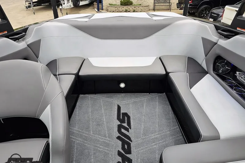 Slide: The Image of 2018 Supreme S226 boat interior with gray seating and branded carpet. - 87