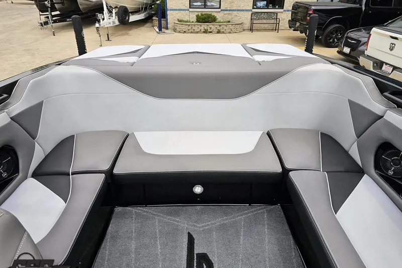 Slide: The Image of 2018 Supreme S226 boat interior with gray and white seating, showcasing modern design. - 88