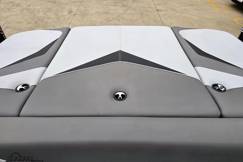 Slide: The Image of Rear seating area of a 2018 Supreme S226 boat, featuring gray and white upholstery. - 94