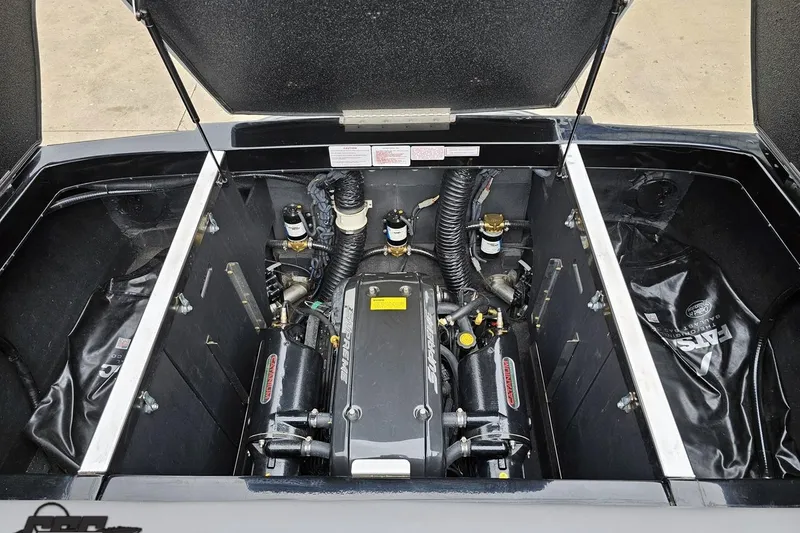 Slide: The Image of Engine compartment of a 2018 Supreme S226 boat, showcasing detailed components and layout. - 95