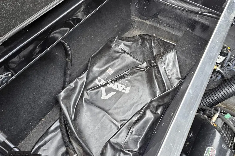 Slide: The Image of Storage compartment of a 2018 Supreme S226 boat with a black ballast bag. - 98