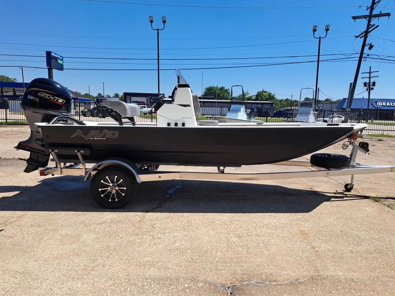 Slide: The Image of Avid 18CC ROGUE 2026 boat on trailer outdoors. - 6