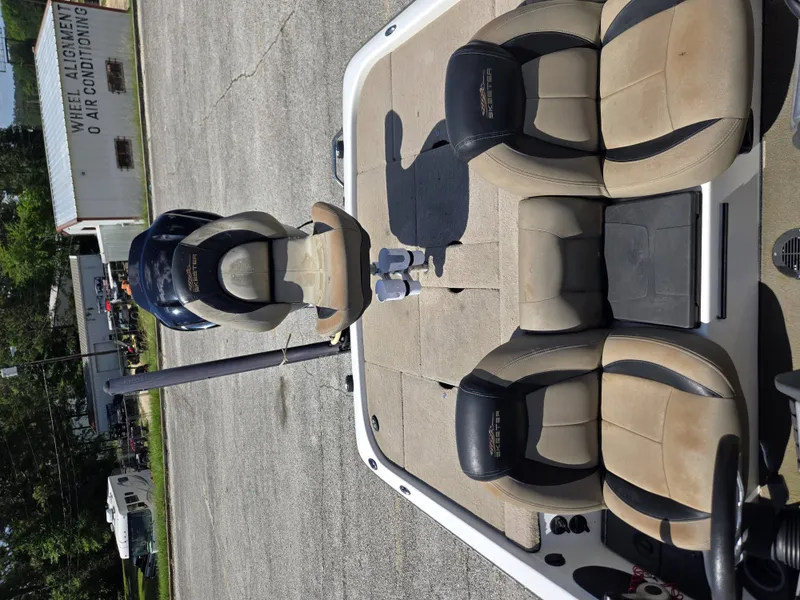 Slide: The Image of Interior of a 2015 Skeeter ZX200 boat with beige seats. - 7
