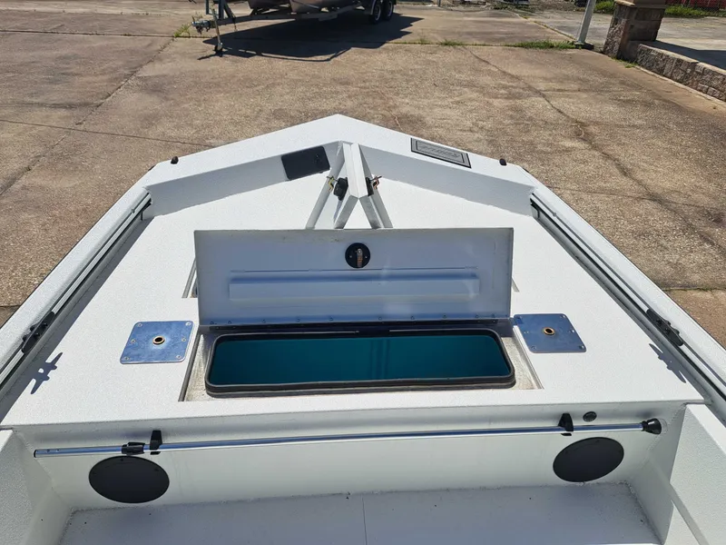Slide: The Image of Avid 18CC ROGUE 2026 boat with open storage compartment on deck. - 10