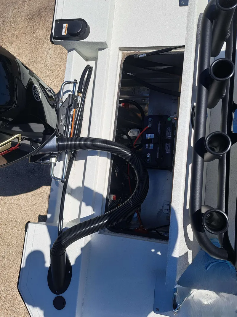 Slide: The Image of Interior view of Avid 18CC ROGUE 2026 boat engine compartment. - 15