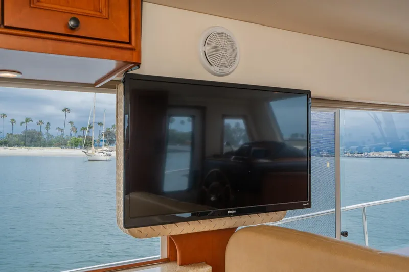 Slide: The Image of Interior of 2011 Mainship 395 Trawler with TV and ocean view. - 55