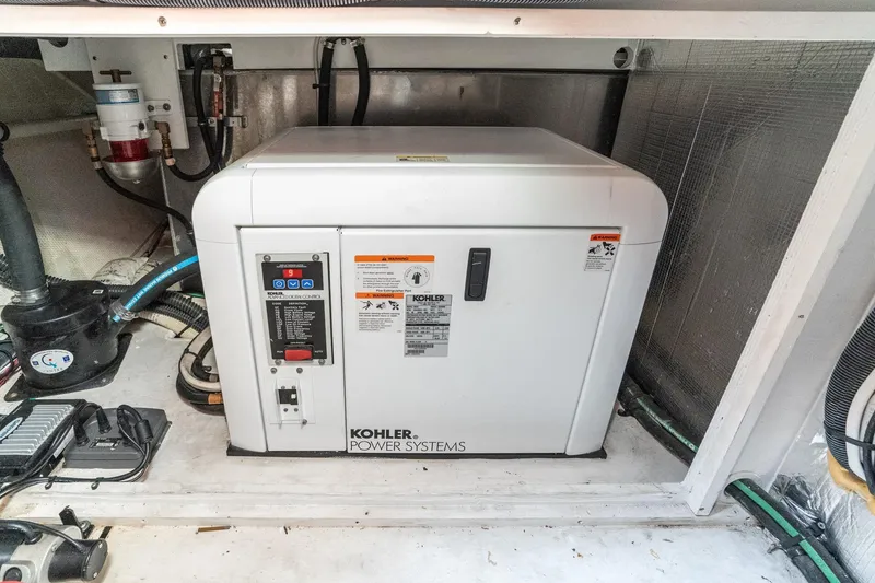 Slide: The Image of Engine room of 2011 Mainship 395 Trawler with Kohler power system generator. - 63