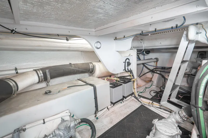 Slide: The Image of Engine room of 2011 Mainship 395 Trawler with visible wiring and components. - 66