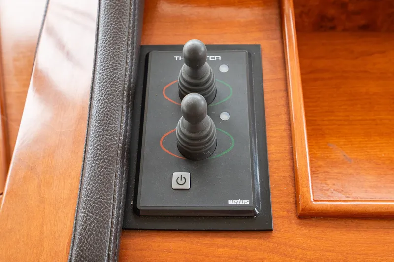 Slide: The Image of Control panel with joysticks on 2011 Mainship 395 Trawler boat. - 9